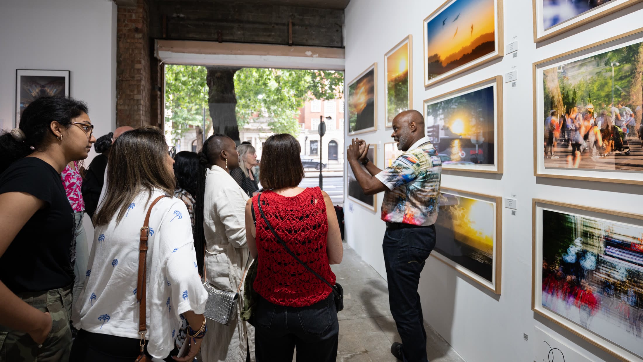 Nigel Ryan discussing his work with visitors at Flux Exhibition